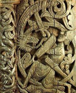 Detail du portail de leglise en bois debout de Setesdal en Norvege representant Saint Michel sous les traits de Sigurd